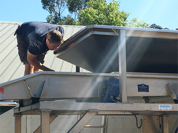 Jeremy overseeing a grape harvest.